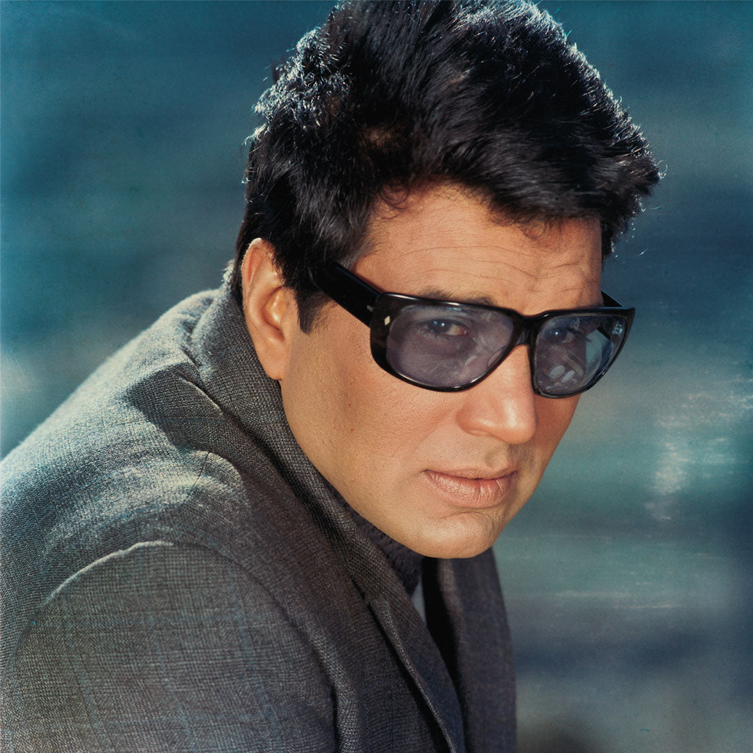 Dharmendra Portrait in a Green Coat with Gogles- still from the movie “LALKAR” Personal Bollywood Photography of renowned cinematographer, Shri Prem Sagar.